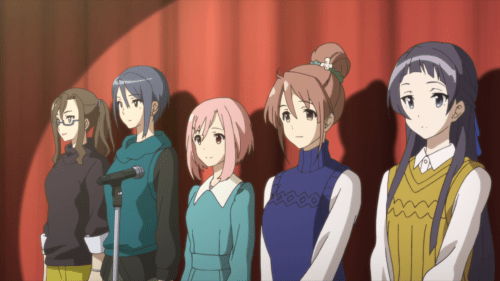 Sakura Quest / Episode 20 / Sanae, Maki, Yoshino, Shiori, and Ririko standing together on stage