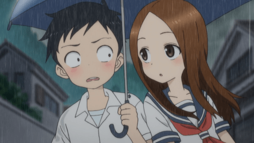 Karakai Jouzu no Takagi-san / Episode 3 / Nishikata and Takagi-san walking together underneath an umbrella in the rain